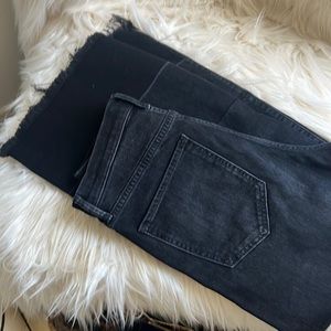 Black high waisted wide leg, raw hem jeans.